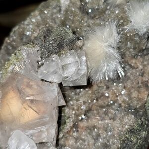 Calcite with encapsulated orange mesolite